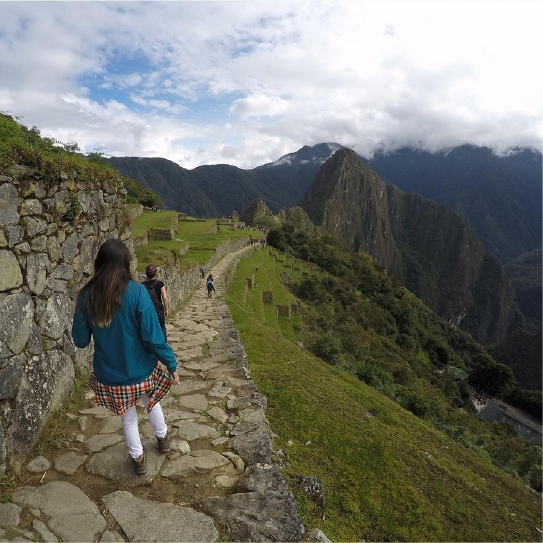 Hikers walking the Inca Trail surrounded by mountains